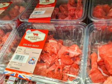 SHEFFIELD, UK - 20TH MARCH 2019: Boswell Farms diced beef for sale inside a Tesco supermarket in Sheffield, UK clipart