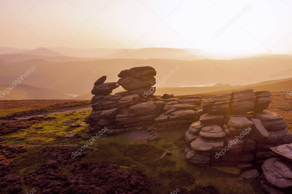 Beautiful sunset over the Wheel Stones found near Derwent Edge in the Peak District National Park, Derbyshire, UK