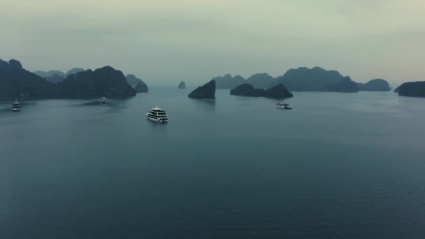 Aerial drone footage of Ha Long Bay and ships in the bay at Sunrise in October 2019 — Stock Video