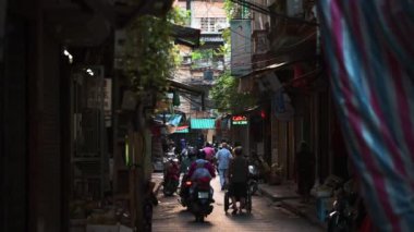 Hanoi, Vietnam - 10th October 2019: Traffic down a small narrow alley in Hanoi, Vietnam.