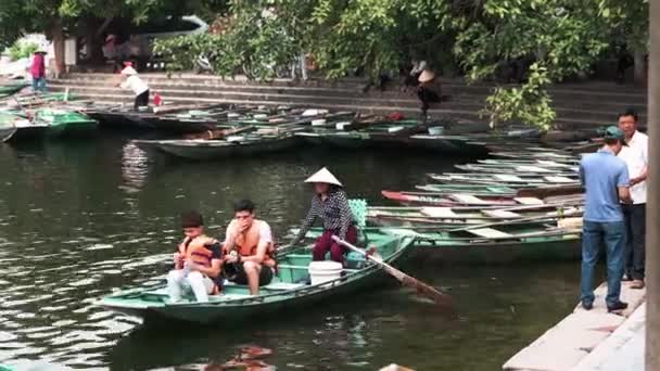 Ninh Binh, Vietnam - 19th October 2019: Tourists take boat tours from Ninh Binh in Northern Vietnam — Stock video