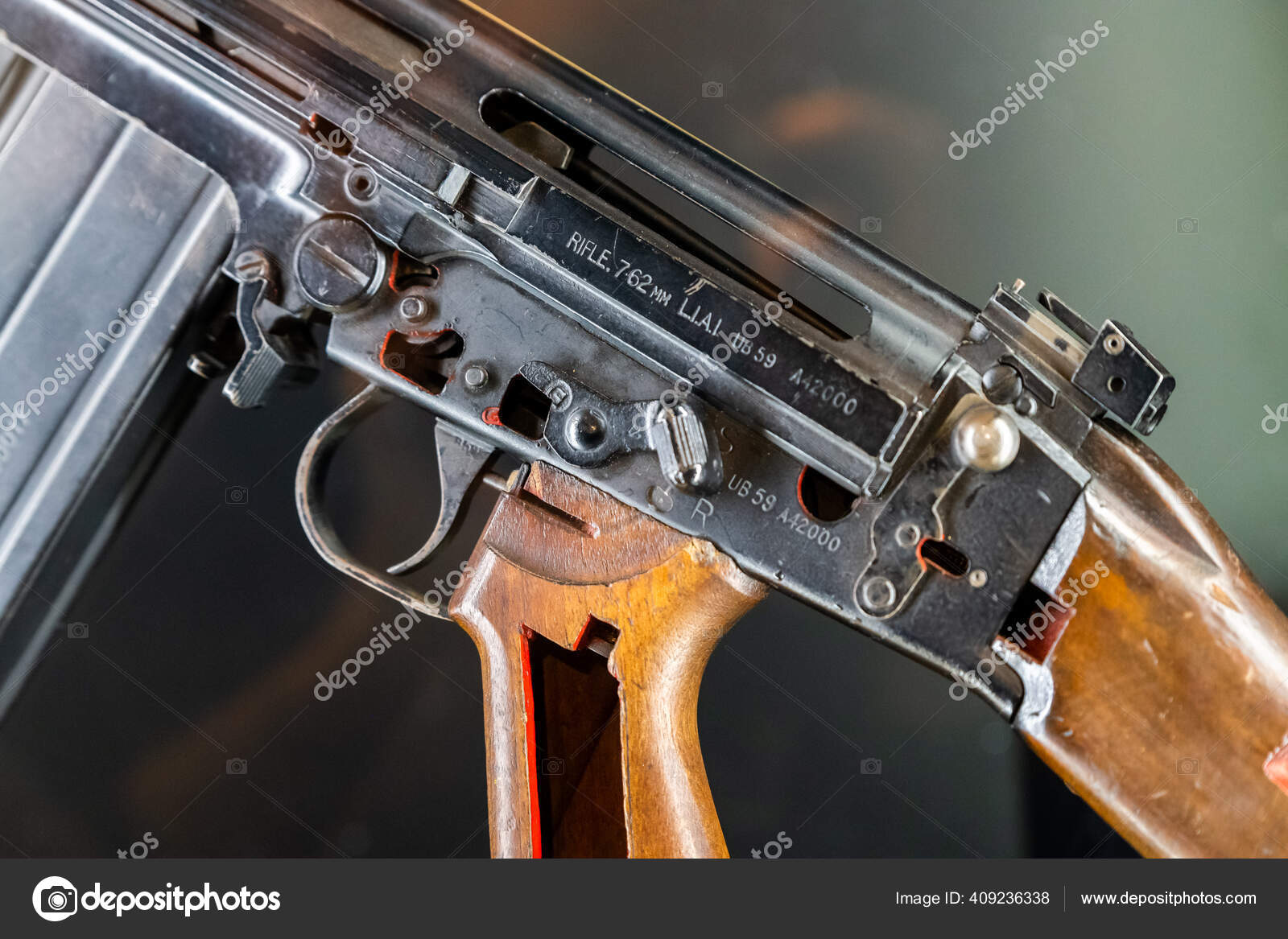 Close up of 7.62mm rifle. Black coloured, broken apart with the parts ...