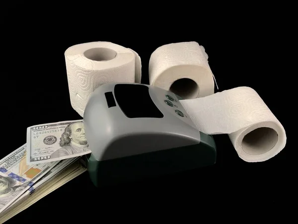 A machine for the production of dollars. Making dollars from toilet paper. Fake American money. Concept: fake dollars, money trash.