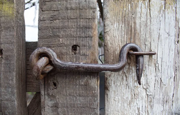 Old lock on the gate. lock on the door of an old rural home. real country style. close-up. focus on the castle