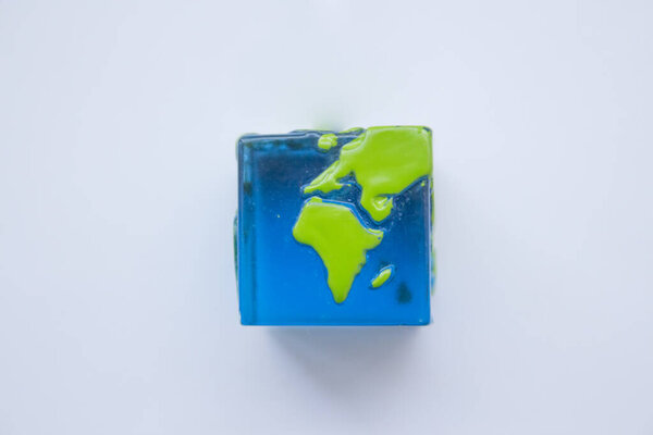 earth square globe on white background. Mock up. Flat lay composition.