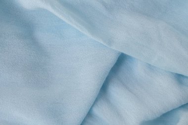 Düz uzanan modern soyut arka plan mavi kumaş. Güzel kıvrımlı doğal mavi doku. Blogger konsepti, Üst Görünüm.