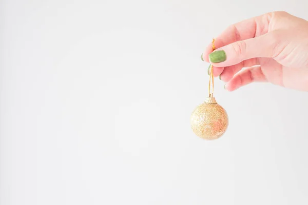 Golden Christmas Ball Hand Young Woman Mock White Background Your — Stock Photo, Image