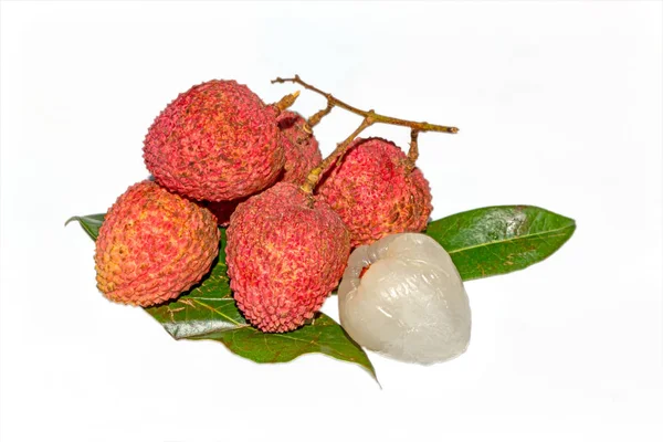 Fresh lychee fruit.Close up view of Peeled and unpeeled Lychee fruit on isolated white background with green leaves.