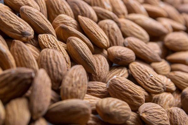 Amêndoas de perto. Alimentos saudáveis . — Fotografia de Stock