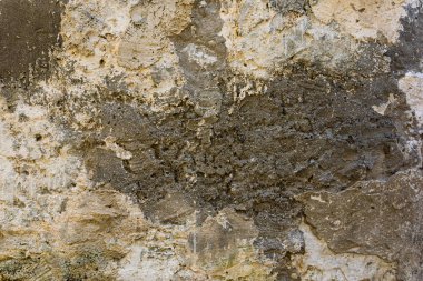 Çok katmanlı çatlak kaplamalı eski sıvalı dokulu duvar.