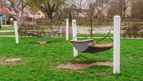 Hammocks in public garden, relax and recreation after work. Place Germany, Bavaria.