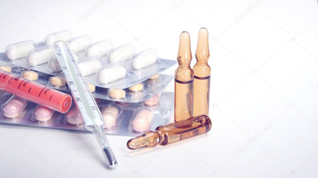 Pharmacy theme, tablets, pills capsule heap mix therapy drugs with medicine antibiotic and thermometer. Close up of capsules. Medicine background for medical concept.