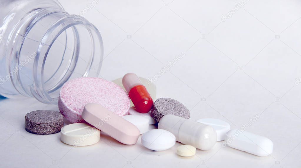Medicines, supplements and drugs in a bottle.Pharmacy theme, tablets, pills capsule heap mix therapy drugs with medicine antibiotic.