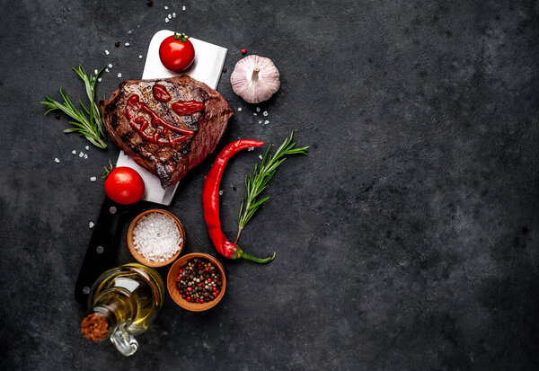 grilled steak with scary face made of ketchup