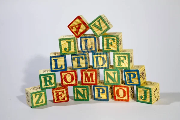 Many Wooden Alphabet Blocks arrange in vertical.