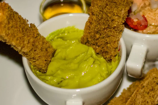 Avocado Dip with brown toasted bread