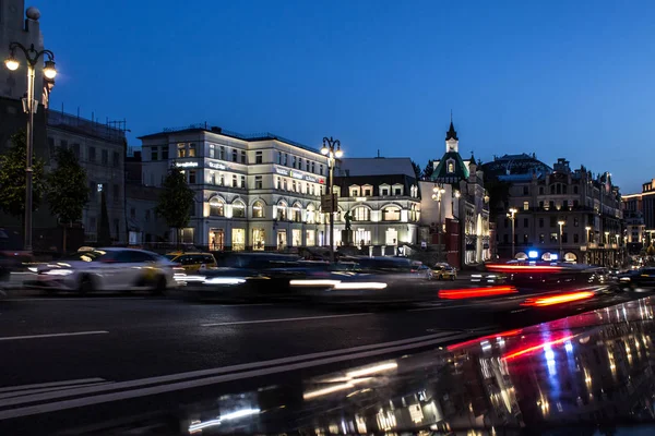 Street with passing cars in the historical center of Moscow Russia