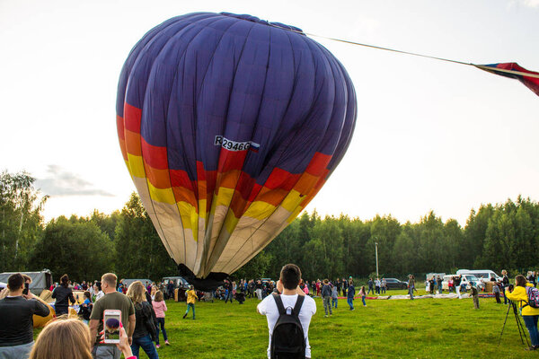 Pereslavl-Zalessky, Yaroslavl region / Russia - July, 20, 2019: inflating and installing balloons to start at the Aeronautics Festival ,   