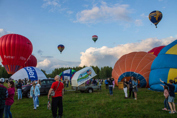 Pereslavl-Zalessky, Yaroslavl region / Russia - July, 20, 2019: inflating and installing balloons to start at the Aeronautics Festival ,   