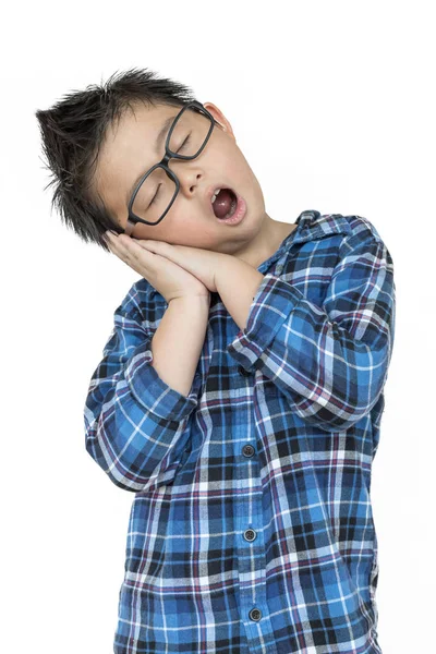 stock image Little child in glasses feels sleepy on isolated white backgroun