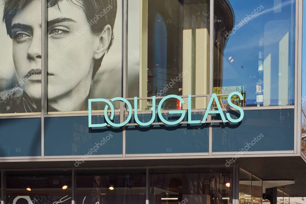 Mainz, Germany - Feb 25 - 2019: Logo sign on the window of a Douglas shop. Douglas GmbH is a German perfume and cosmetics retailer