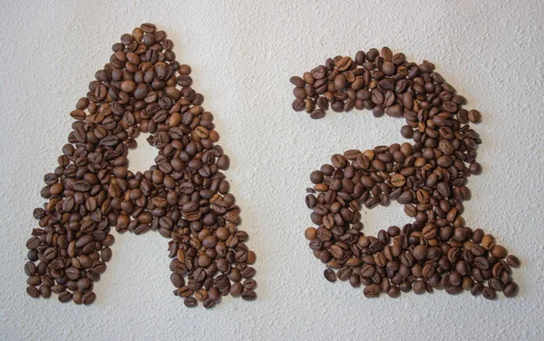 Imagen Granos Café Tostados Forma Alfabeto Sobre Fondo Blanco — Foto de Stock