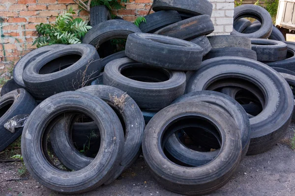 old worn tires are a big pile in a landfill