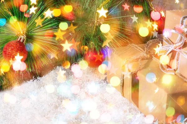 New Year and Christmas background for greetings, banner, postcard, advertisement with place for text. Box with gifts close-up on a bokeh background. Copy space, front view.