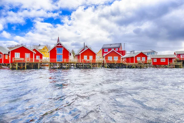 Travel Ideas. Red Fisherman Houses on Lofoten islandsat a Spring Sunny Day.Horizontal image Orientation