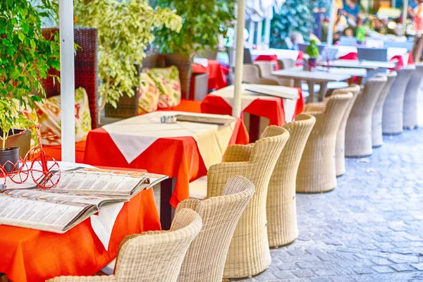 Classic Tranquil Cretan Open Air Restaurant with Authentic straw Chairs in Front of Tables.Horizontal Image Composition