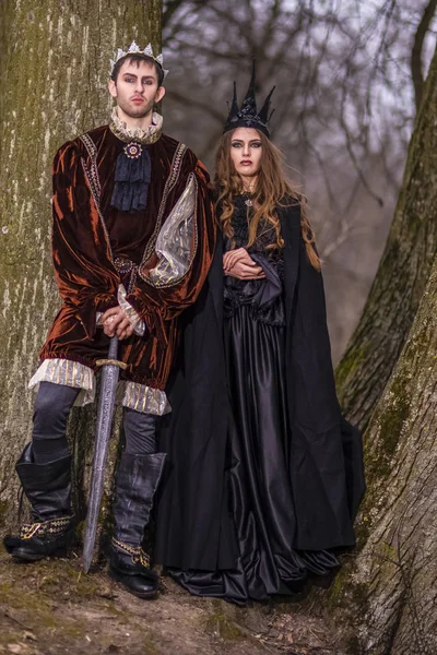 Cosplay Ideas.Caucasian Couple as King and Queen in Fur Medieval Outfit