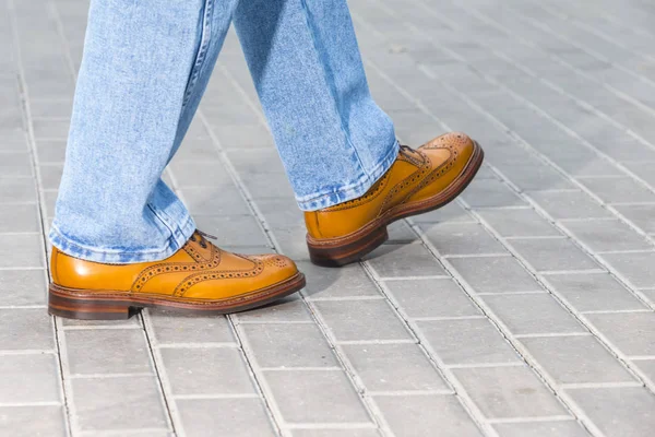 Close-up of Male Legs Wearing Leather Brown Oxford Semi Brogues
