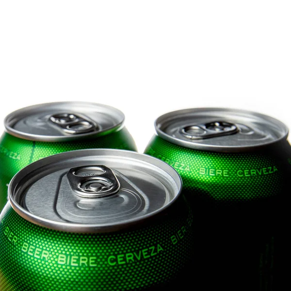 Three green cans of beer.