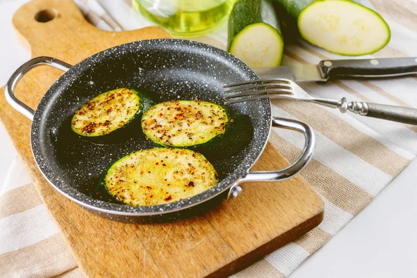 Zucchini snack in a small pan.