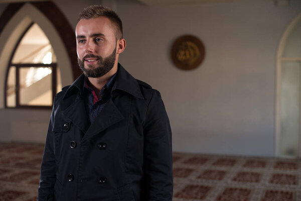 Portrait of a Young Muslim Man Making Traditional Prayer To God Allah