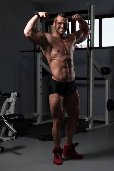 Handsome Young Man Standing Strong Gym Flexing Muscles Muscular Athletic — Stock Photo, Image