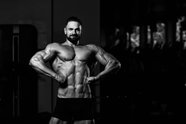 Handsome Young Man Standing Strong Gym Flexing Muscles Muscular Athletic — Stock Photo, Image