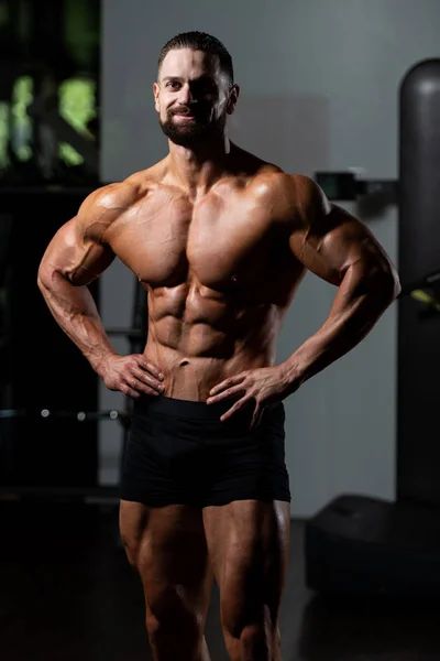 Handsome Young Man Standing Strong Gym Flexing Muscles Muscular Athletic — Stock Photo, Image