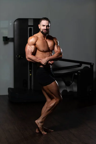 Handsome Young Man Standing Strong Gym Flexing Muscles Muscular Athletic — Stock Photo, Image