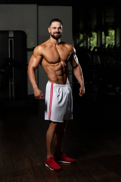 Handsome Young Man Standing Strong Gym Flexing Muscles Muscular Athletic — Stock Photo, Image