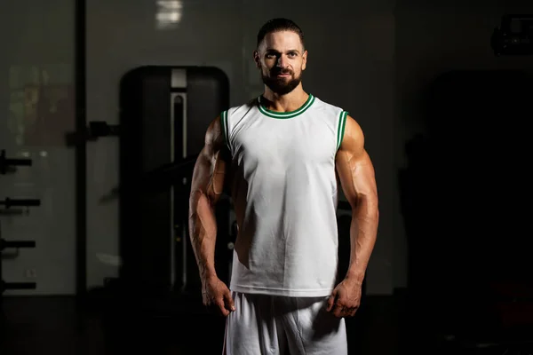 Portrait Of Personal Trainer In Sports Outfit In Fitness Center Gym Standing Strong