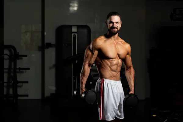 Atleet Trainen Biceps Een Fitnessruimte Dumbbell Concentratie Krullen — Stockfoto