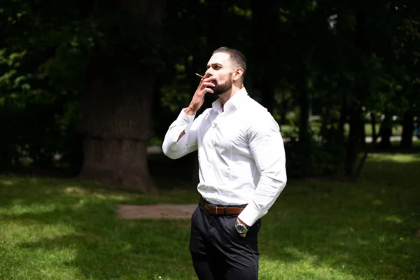 Portrait Young Physically Fit Businessman Smokes Cuban Cigar Park — Stock Photo, Image