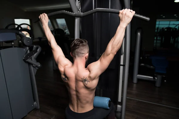 Handsome Athlete Doing Heavy Weight Exercise Back Machine — Stock Photo, Image