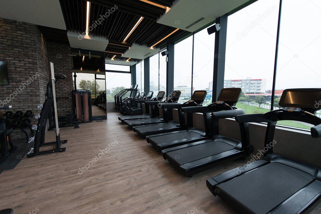 Equipment And Machines At The Modern Gym Room Fitness Center