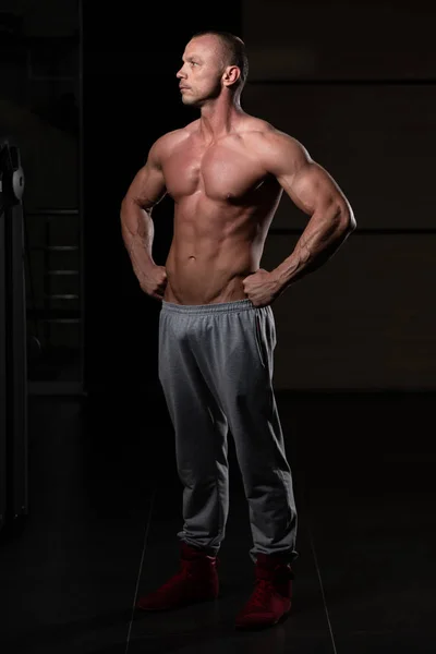 Handsome Young Man Standing Strong Gym Flexing Muscles Muscular Athletic — Stock Photo, Image