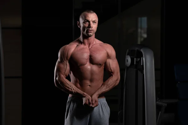 Handsome Young Man Standing Strong Gym Flexing Muscles Muscular Athletic — Stock Photo, Image