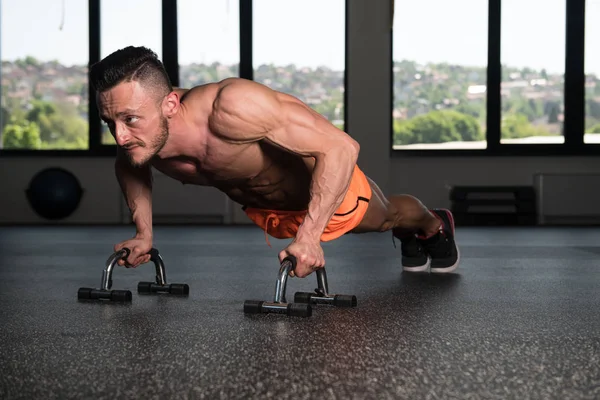 Young Model Doing Push Ups As Part Of Bodybuilding Training