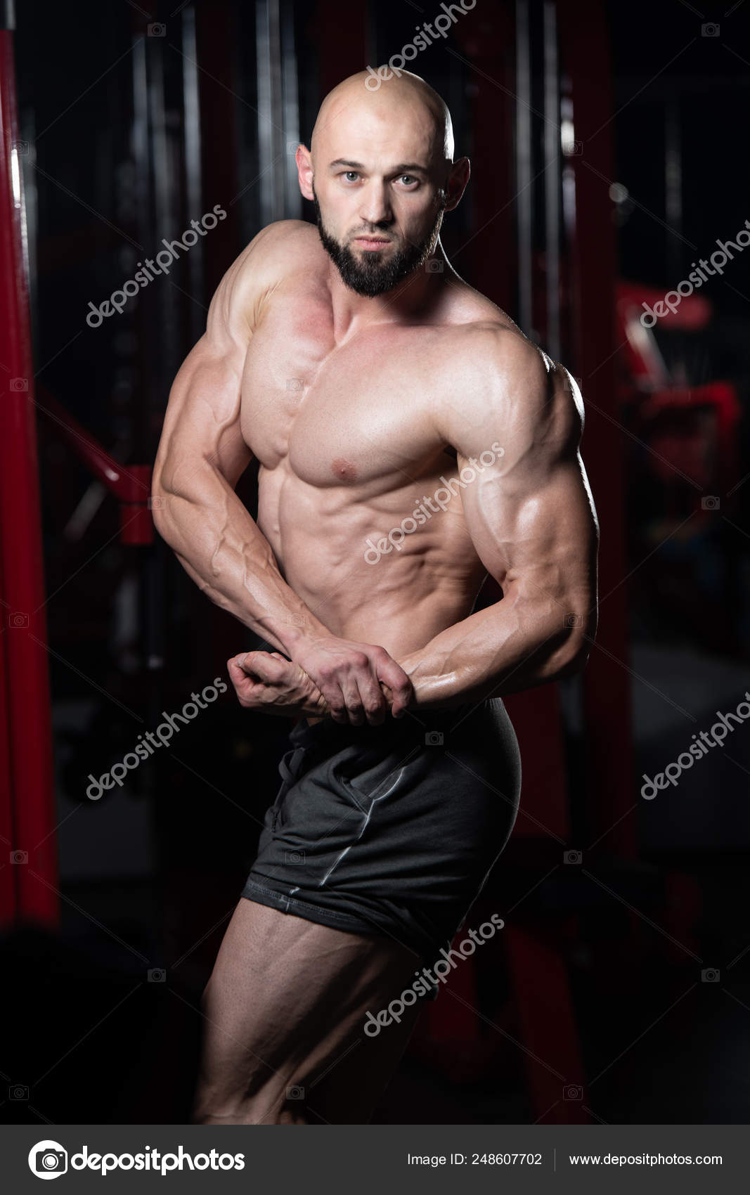 Bodybuilder Performing Side Chest Pose Stock Photo by ©ibrak 248607702