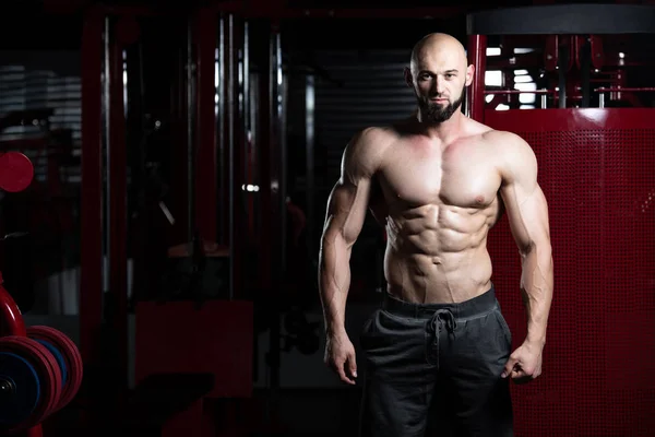 Healthy Young Man Flexing Muscles — Stock Photo, Image